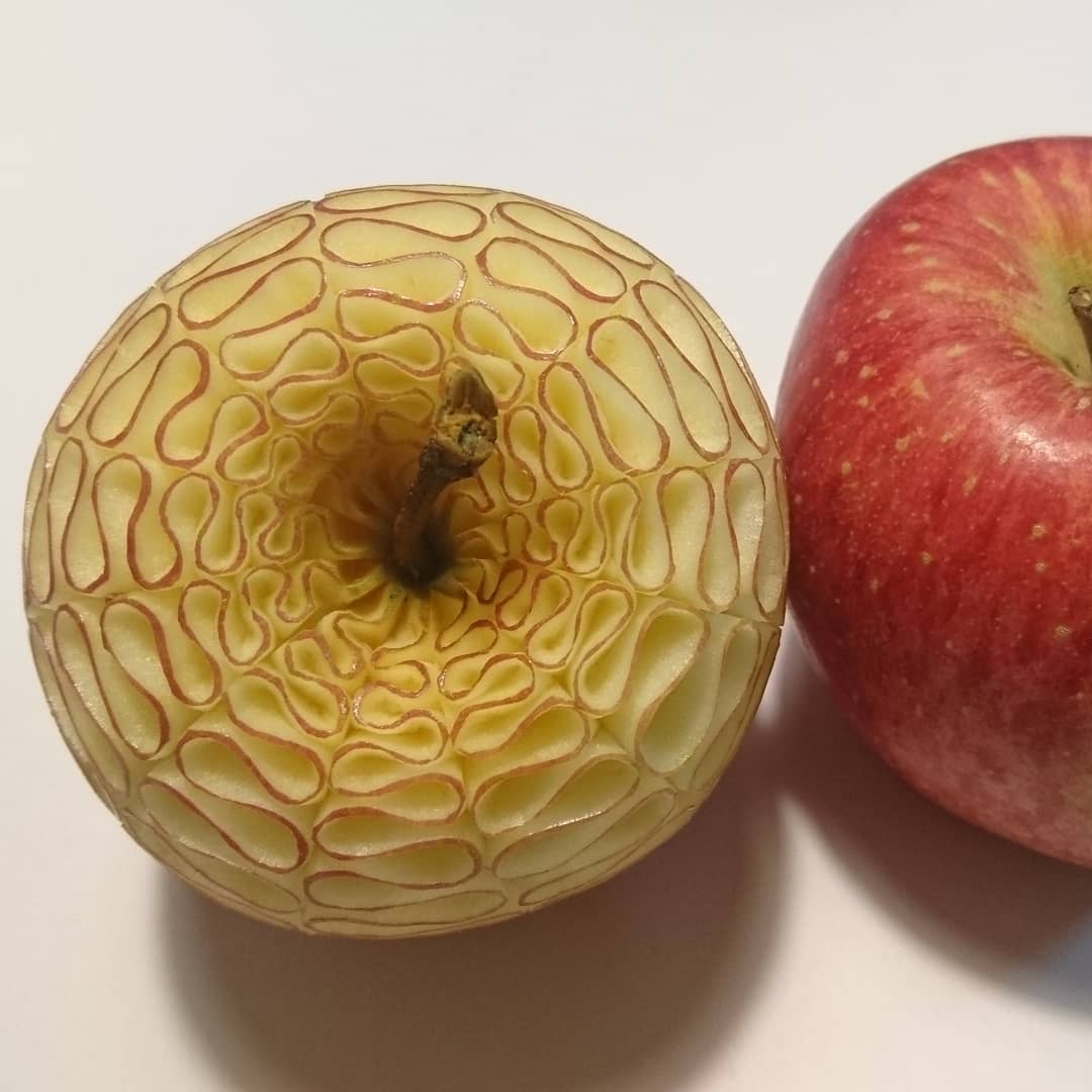 Apple intricately carved into a detailed pattern