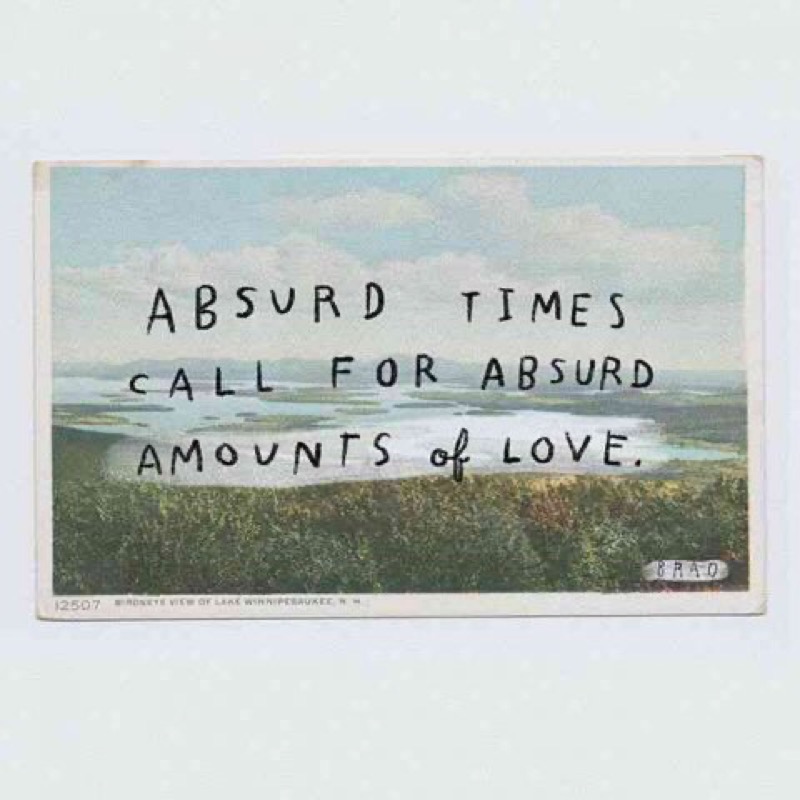 Sign saying absurd times call for an absurd amount of love