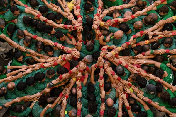 Members of the Colla Castellers de Sabadell build a human tower